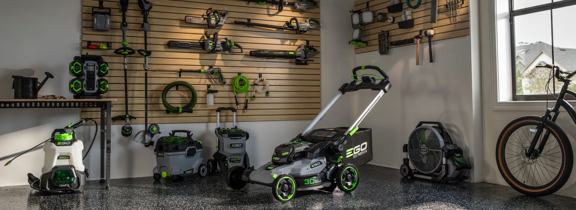 EGO POWER+ cordless tools organized in a garage